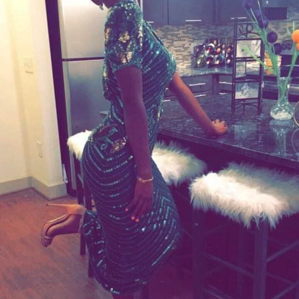 Dark green embellished evening gown